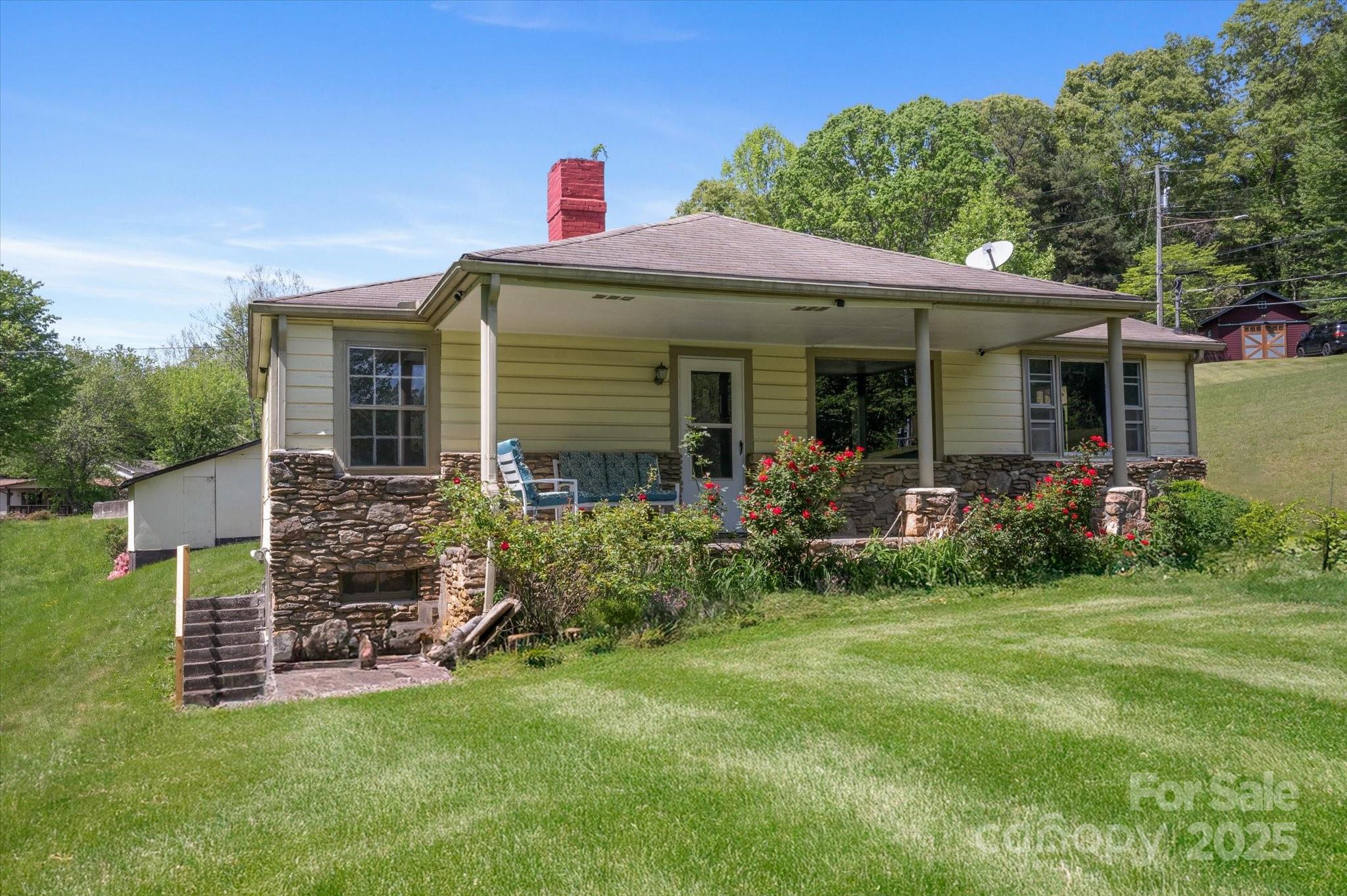 35 Homeway Road Asheville, NC 28806 - Photo 6 of 32 a front view of a house with garden