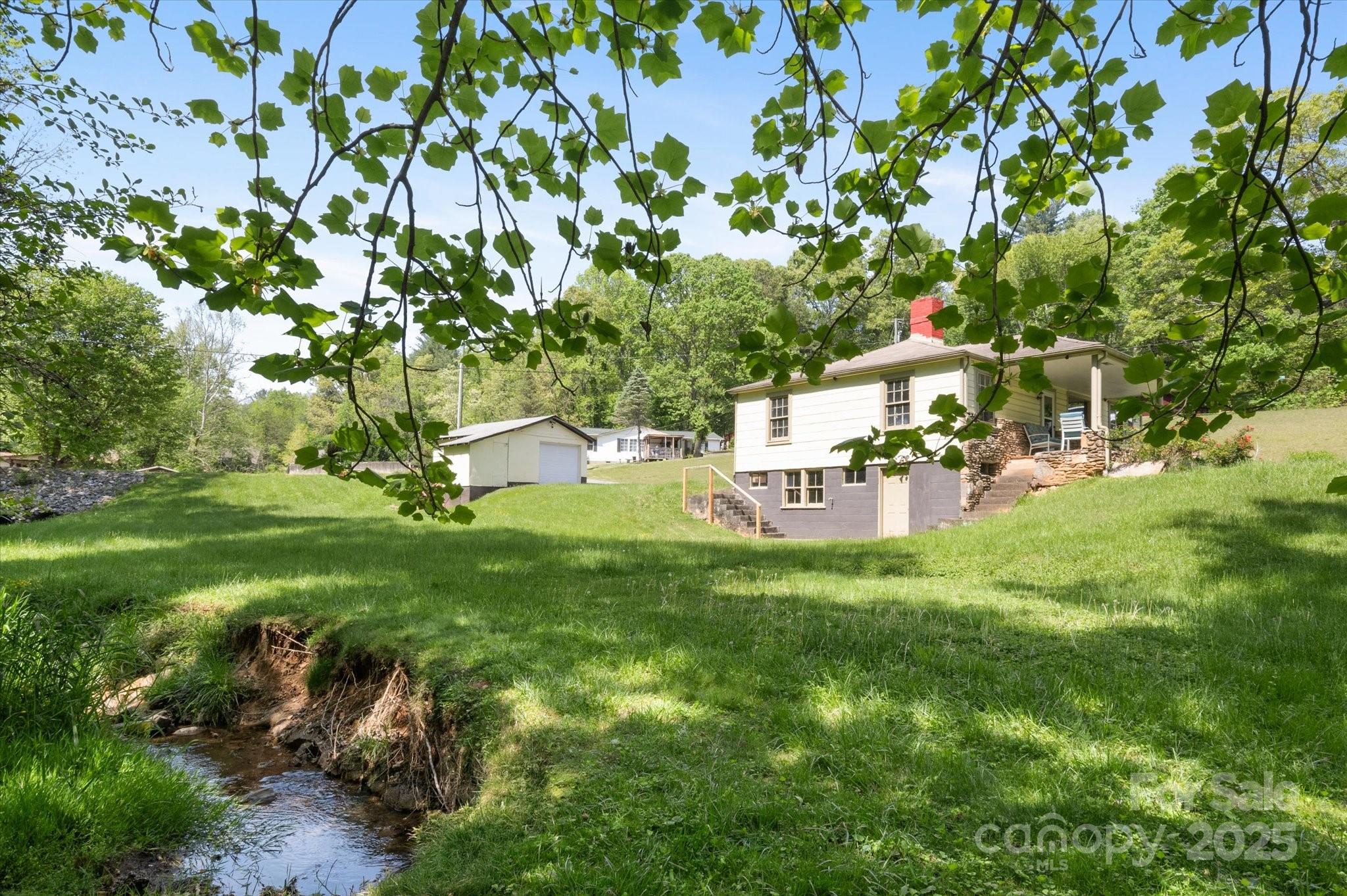 35 Homeway Road Asheville, NC 28806 - Photo 7 of 32 a view of a park with large trees
