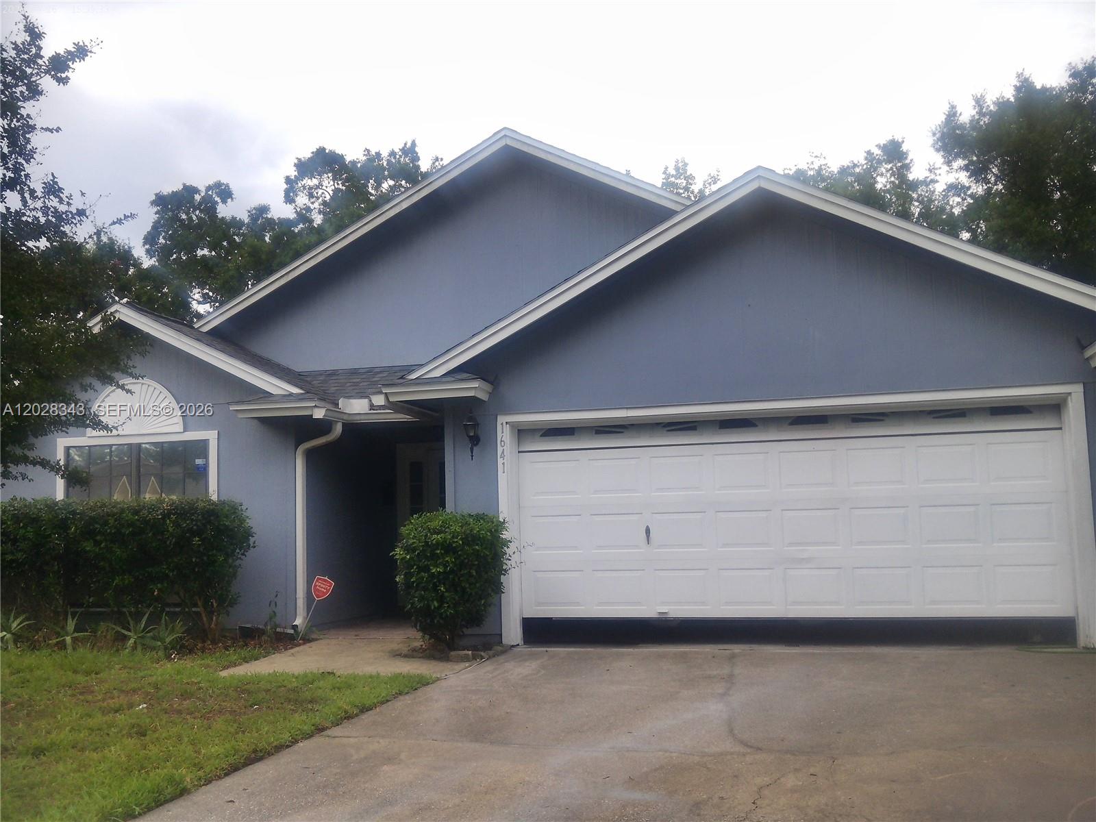 1641 Spring Oaks Lane Jacksonville, FL 32221 - Photo 1 of 44 a backyard of a house with lots of green space