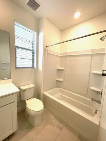 a bathroom with a toilet a sink and a bathtub