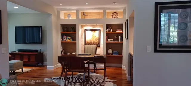 a view of a dining room with furniture and window