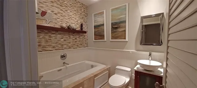 a bathroom with a toilet and a sink