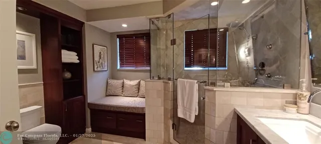 a bathroom with a sink vanity and a mirror
