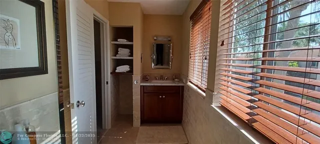 a bathroom with a sink and a shower