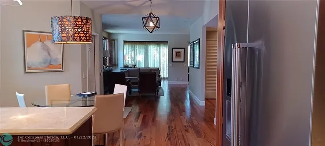 a view of a dining room with furniture and window