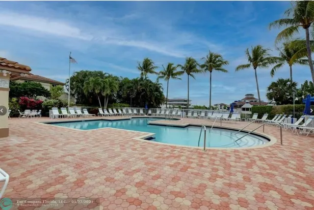 a view of a swimming pool and lounge chair