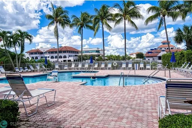 a view of swimming pool with outdoor seating