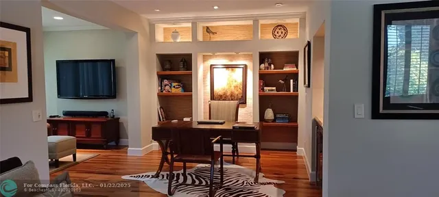 a view of a dining room with furniture and window