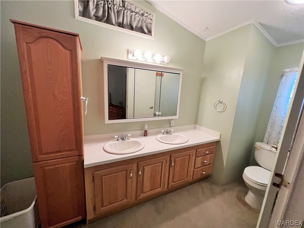 2336 South Rease Road Kingman, AZ 86401 - Photo 9 of 41 Bathroom featuring oversized vanity, double sink, and toilet