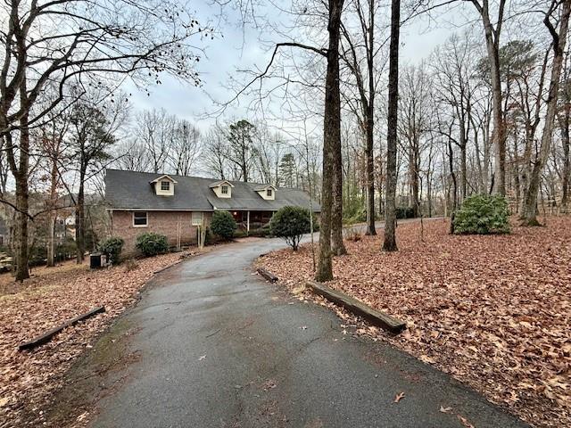 4570 Settles Bridge Road Suwanee, GA 30024 - Photo 12 of 21 a front view of a house with a yard and garage