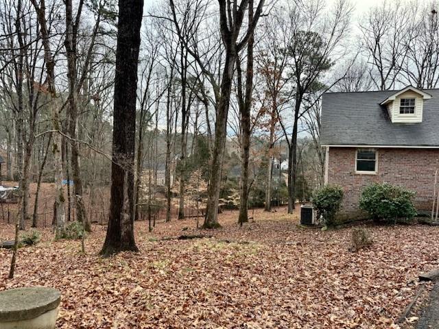 4570 Settles Bridge Road Suwanee, GA 30024 - Photo 14 of 21 a backyard of a house with lots of green space