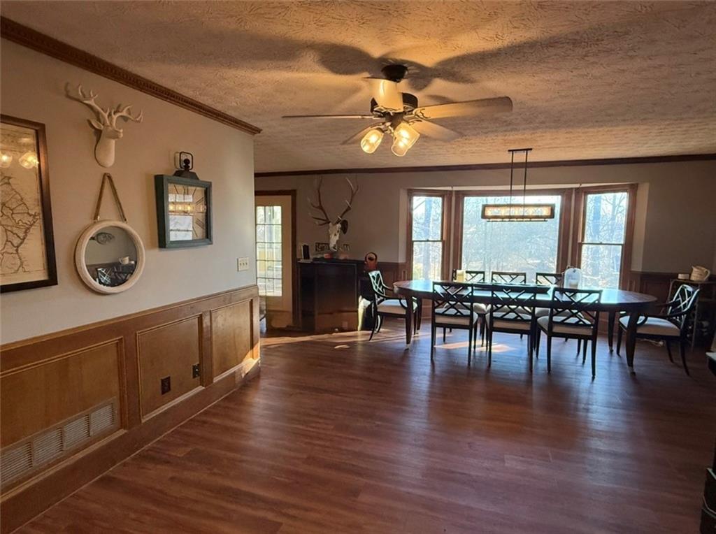 4570 Settles Bridge Road Suwanee, GA 30024 - Photo 18 of 21 a view of dining room with furniture and wooden floor