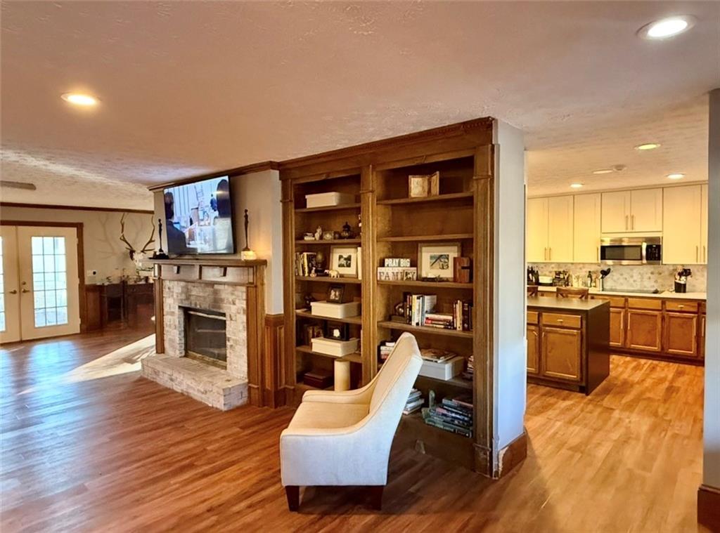 4570 Settles Bridge Road Suwanee, GA 30024 - Photo 5 of 21 a living room with furniture and a kitchen