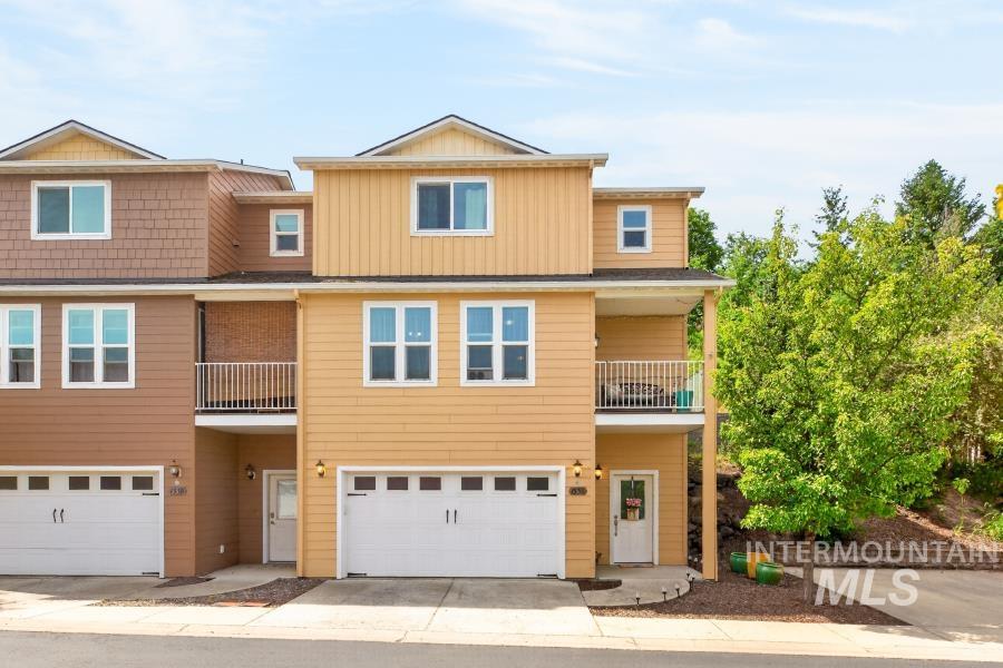 1337 Bristol Road Moscow, ID 83843 - Photo 28 of 28 Three-story townhome featuring a two-car garage, upper-level balcony, and multiple windows