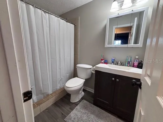 a backyard of a house with a yard table and chairs