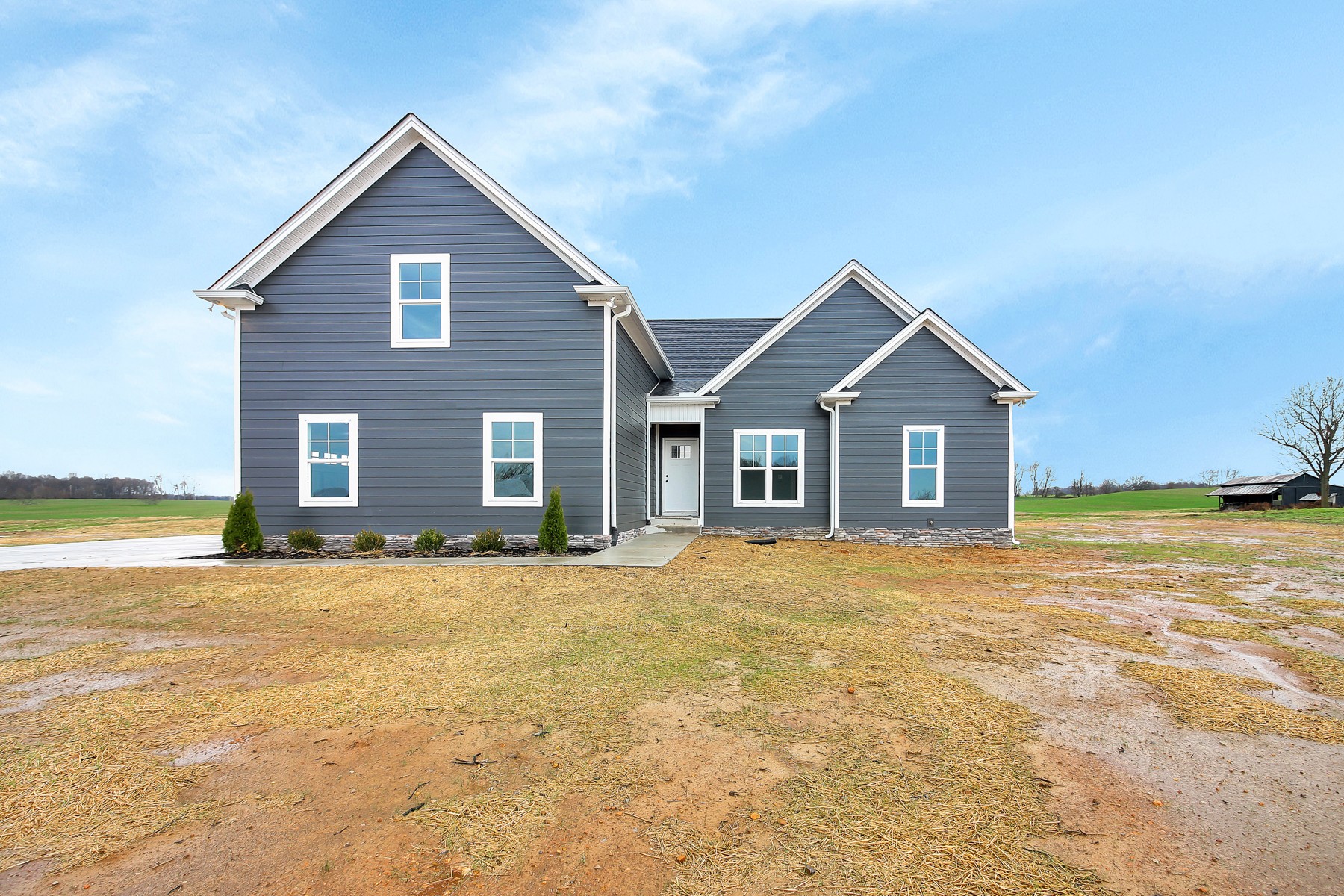 4889 Barren Plains Road Springfield, TN 37172 - Photo 1 of 17 a front view of a house with a yard and garage