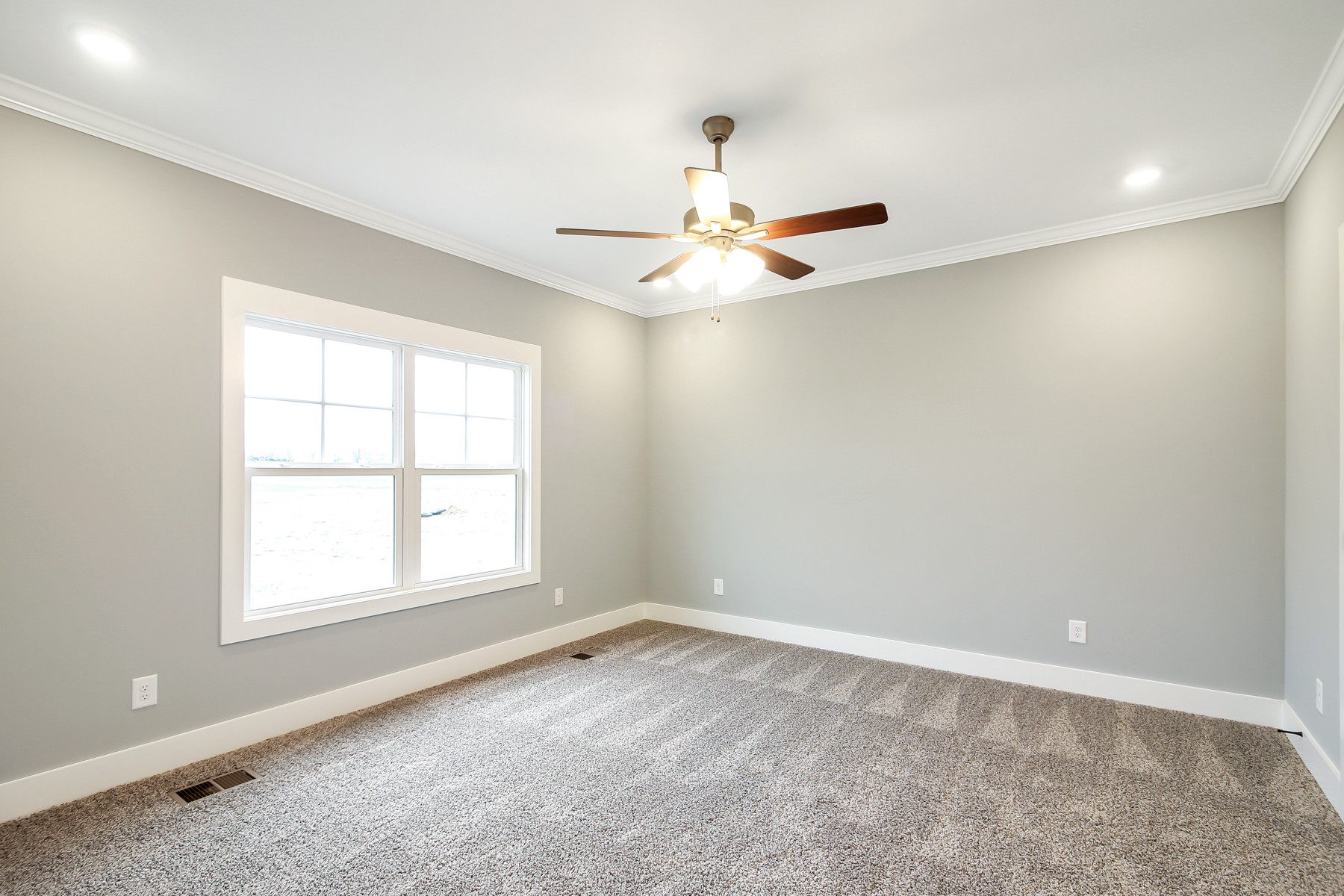 4889 Barren Plains Road Springfield, TN 37172 - Photo 8 of 17 an empty room with a window and a fan