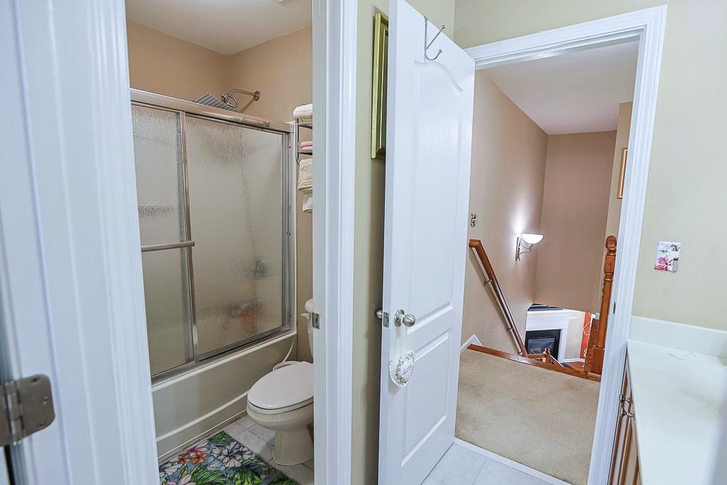 300 Hampton Place Canton, GA 30115 - Photo 40 of 82 a bathroom with a granite countertop shower a toilet and a sink
