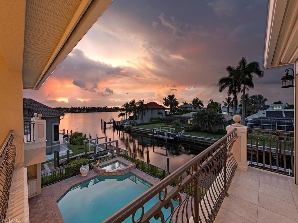 1860 Kingfish Road Naples, FL 34102 - Photo 1 of 24 Sunset Views from second floor balcony.