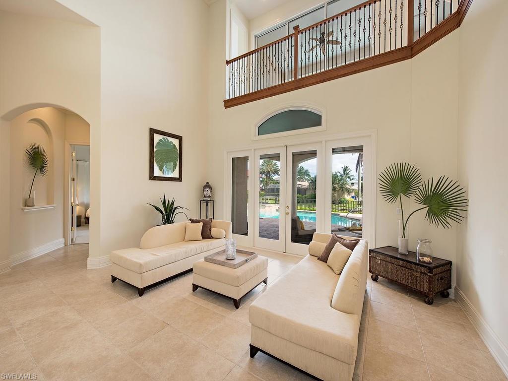 1860 Kingfish Road Naples, FL 34102 - Photo 6 of 24 Large bright Great Room. Views to pool and canal.