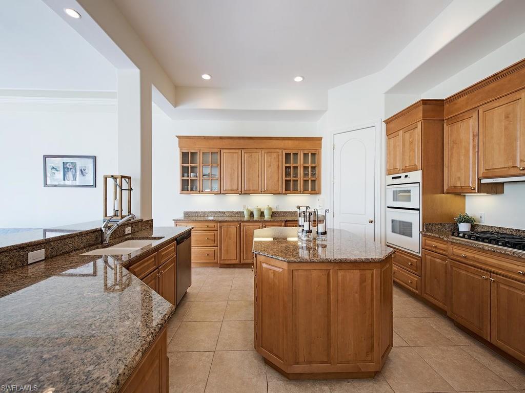 1860 Kingfish Road Naples, FL 34102 - Photo 8 of 24 Large, open gourmet kitchen with desirable gas cook top.