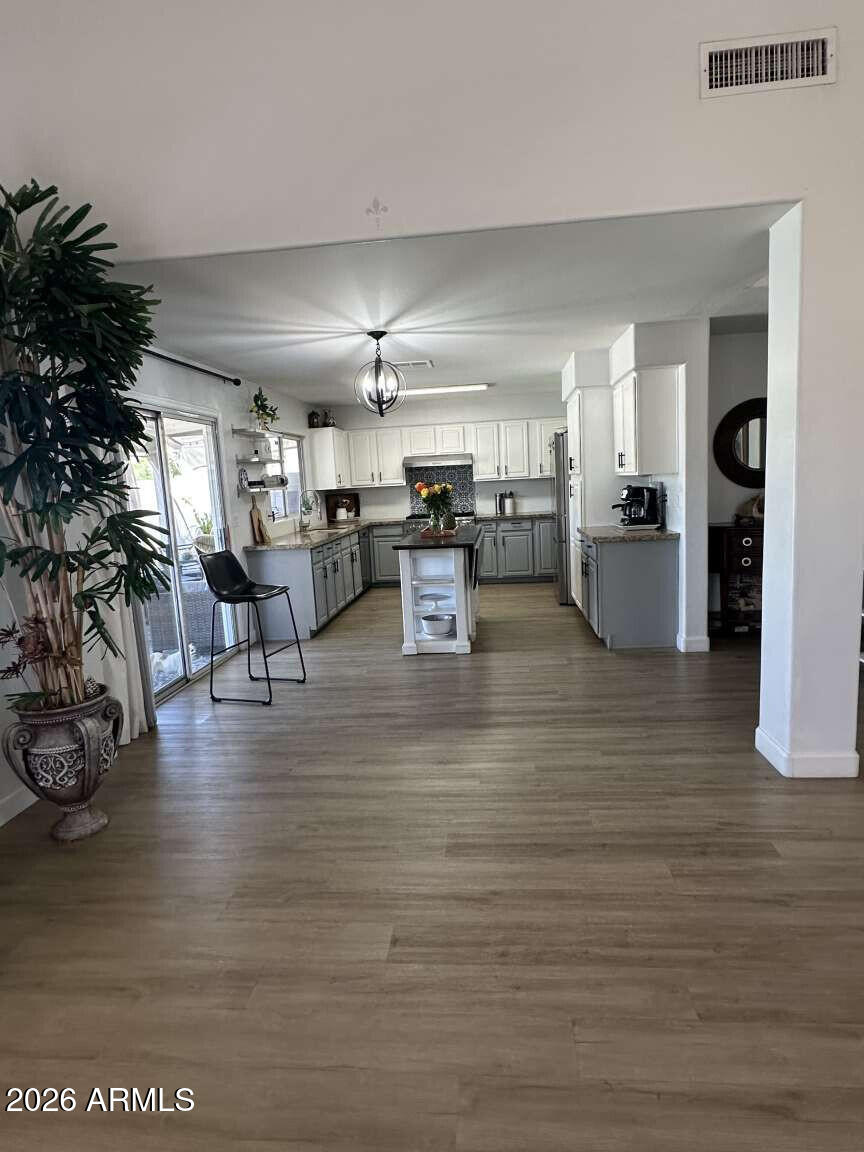 2576 East Brooks Street Gilbert, AZ 85296 - Photo 13 of 18 a living room with furniture and a wooden floor
