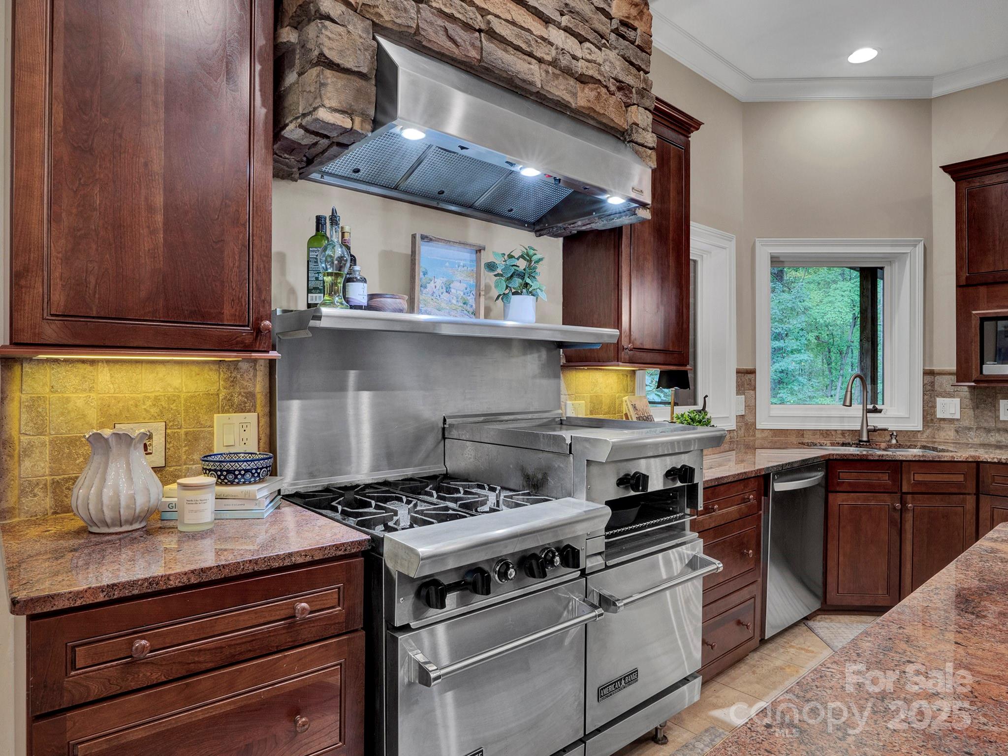 225 Riverton Road Weddington, NC 28104 - Photo 11 of 41 a kitchen with stainless steel appliances granite countertop a stove and a sink