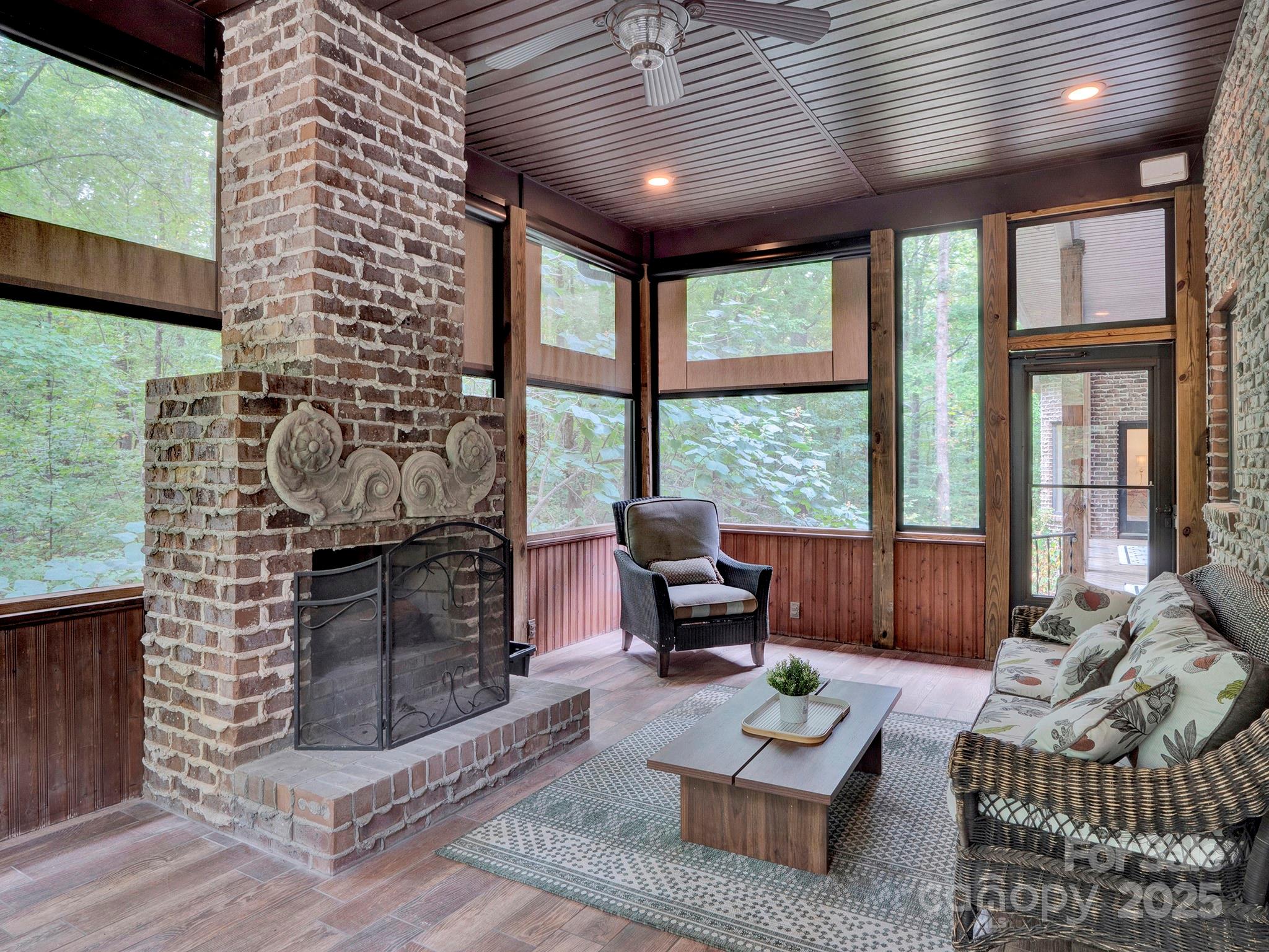 225 Riverton Road Weddington, NC 28104 - Photo 14 of 41 a living room with furniture and a fireplace