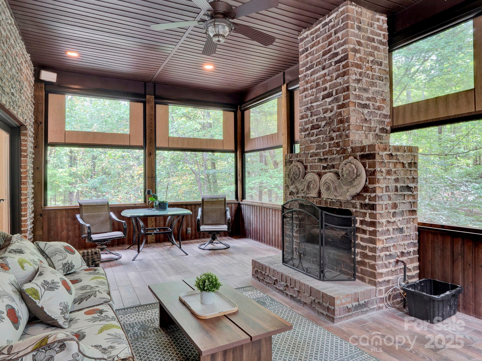 225 Riverton Road Weddington, NC 28104 - Photo 15 of 41 a living room with fireplace furniture and a floor to ceiling window
