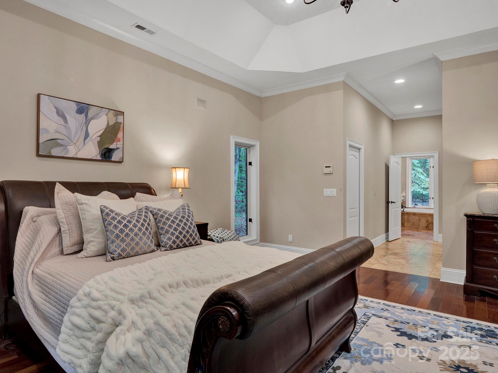225 Riverton Road Weddington, NC 28104 - Photo 17 of 41 a bedroom with bed and wooden floor