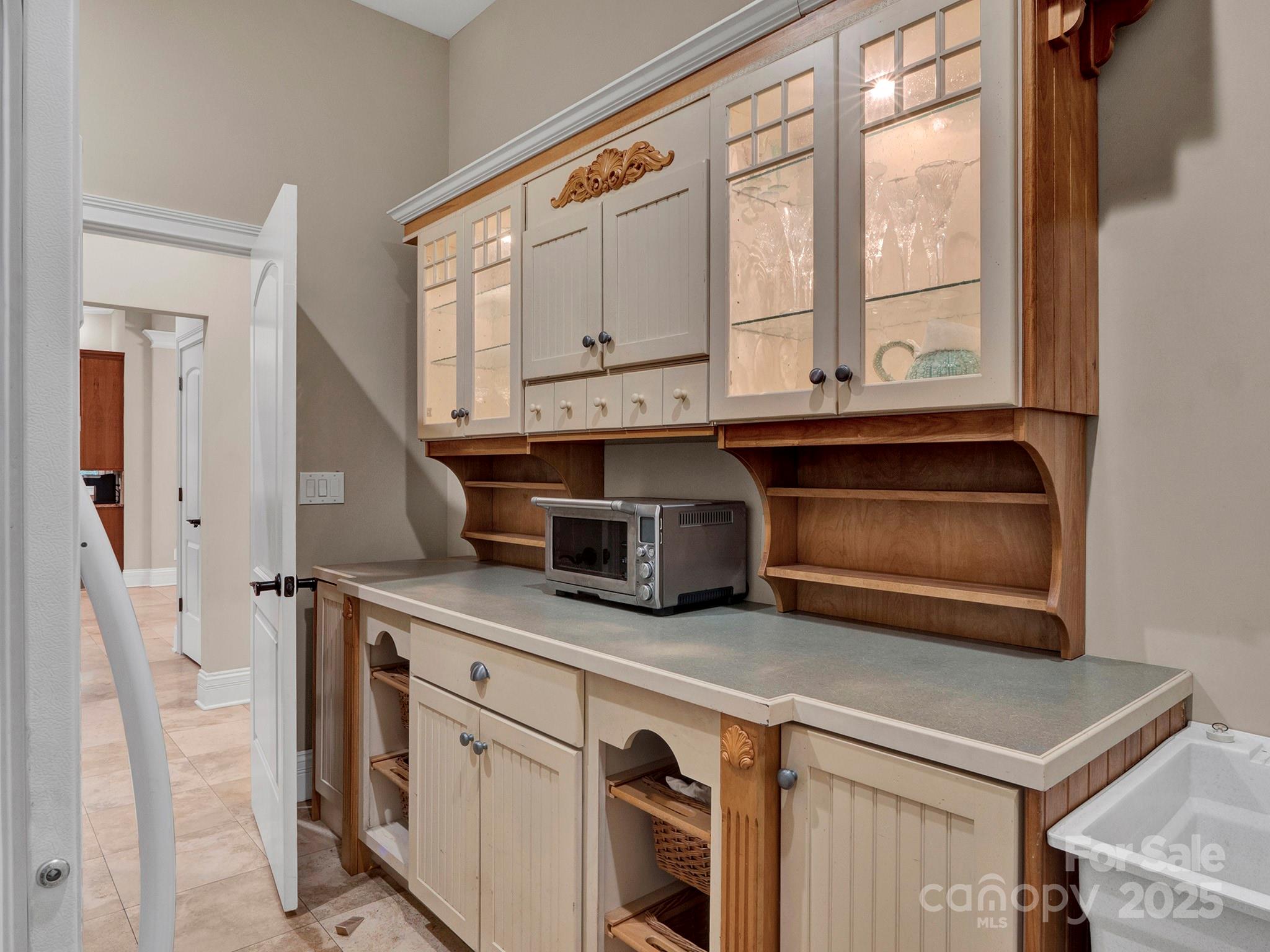 225 Riverton Road Weddington, NC 28104 - Photo 21 of 41 a kitchen with granite countertop a stove a sink and a microwave