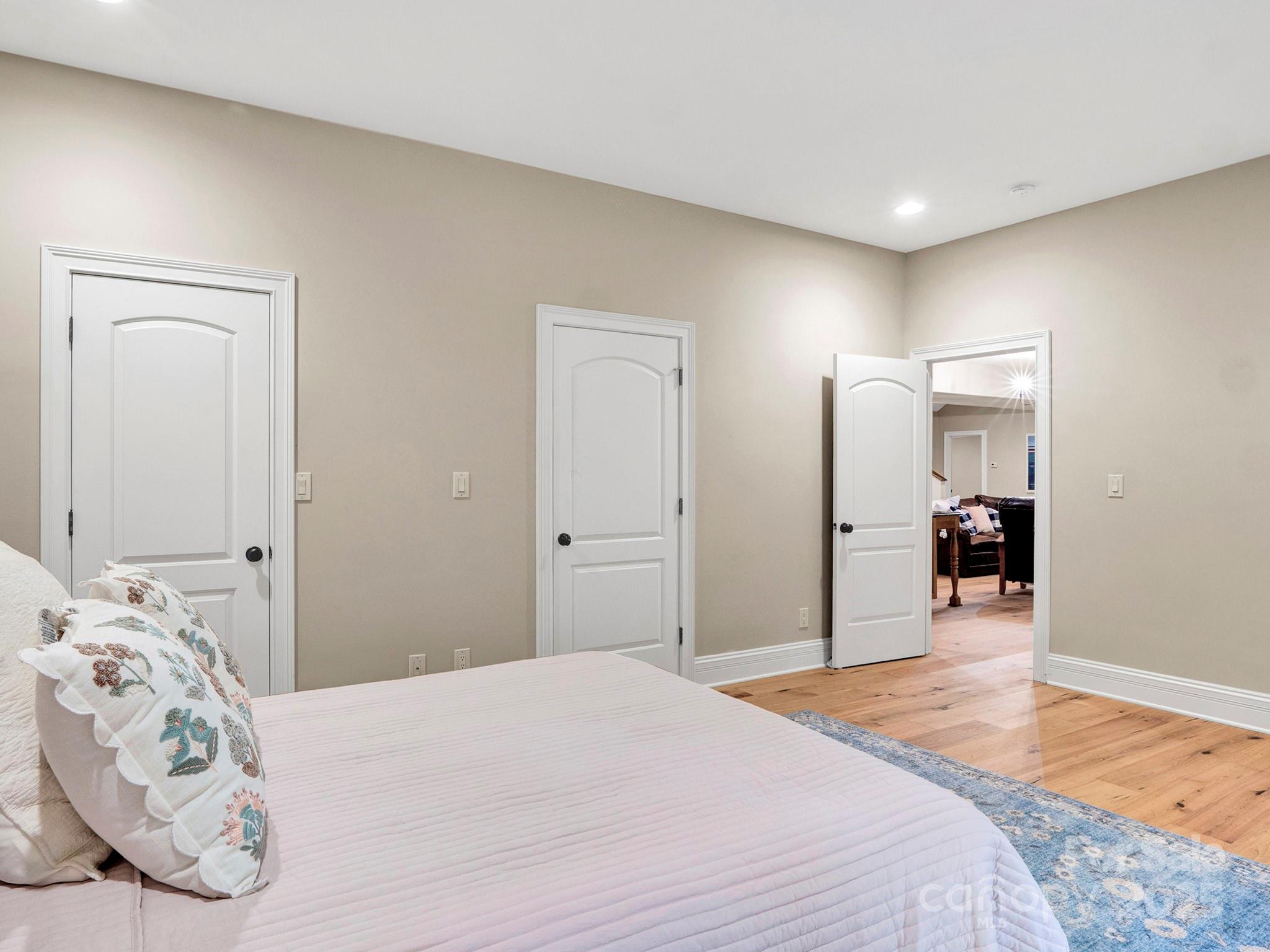 225 Riverton Road Weddington, NC 28104 - Photo 32 of 41 a bedroom with a bed and a mirror