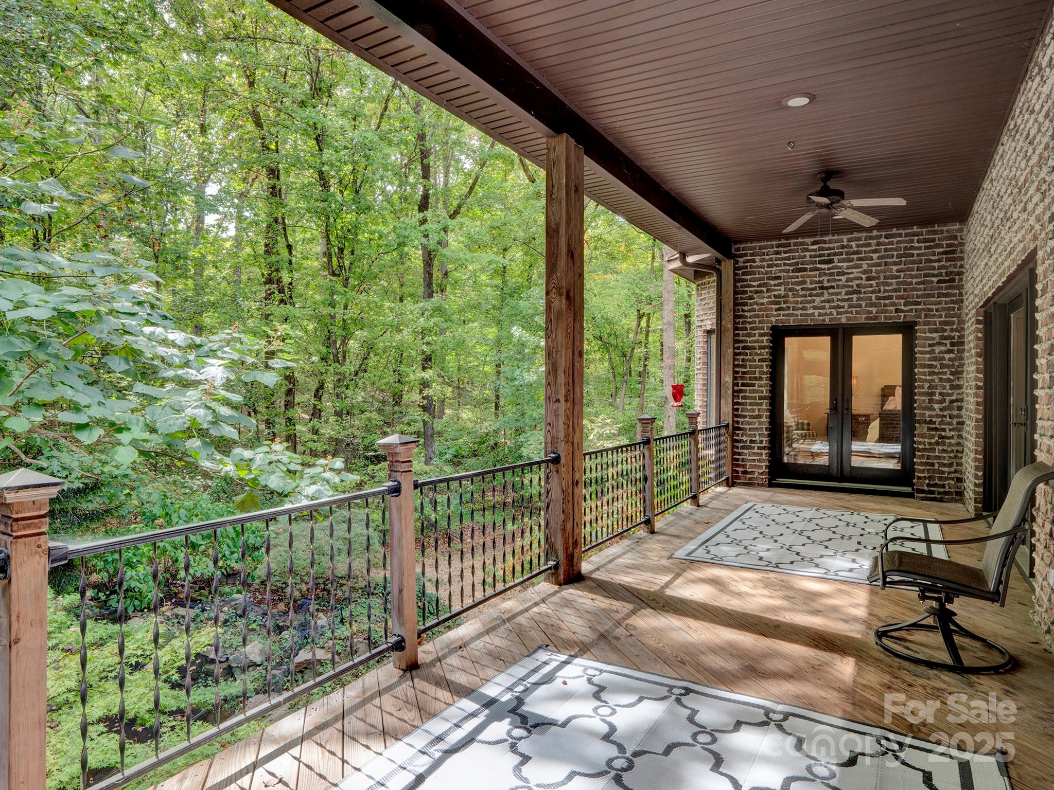 225 Riverton Road Weddington, NC 28104 - Photo 37 of 41 a view of a porch with wooden floor and iron stairs