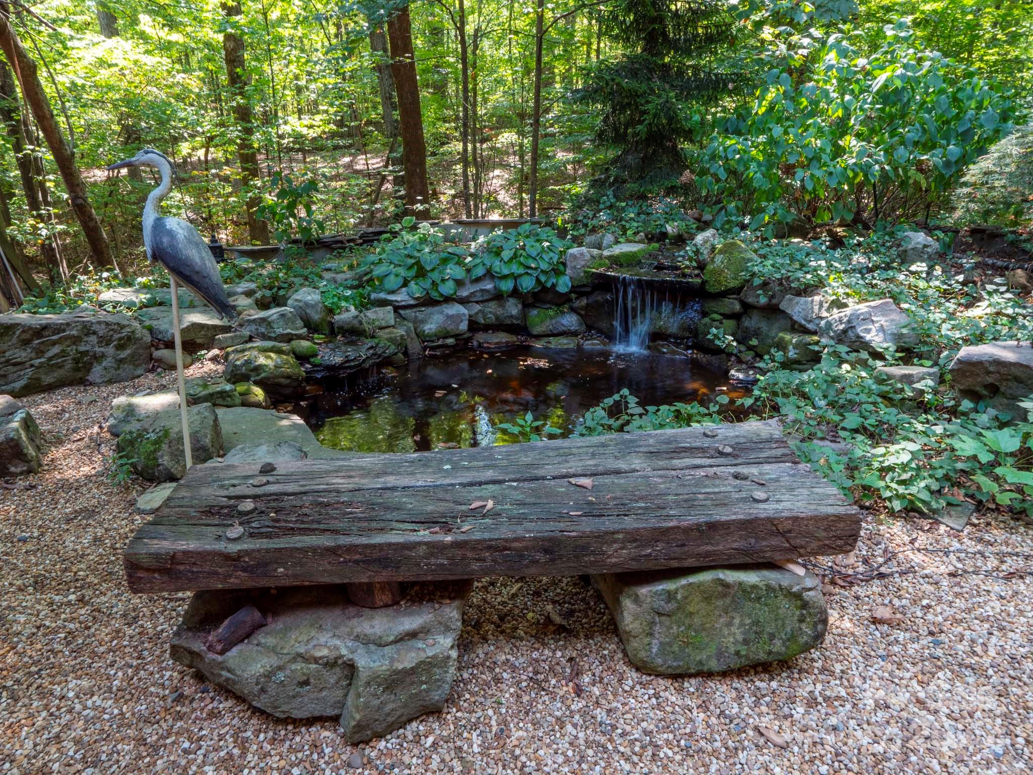 225 Riverton Road Weddington, NC 28104 - Photo 39 of 41 a view of a backyard with plants and outdoor seating