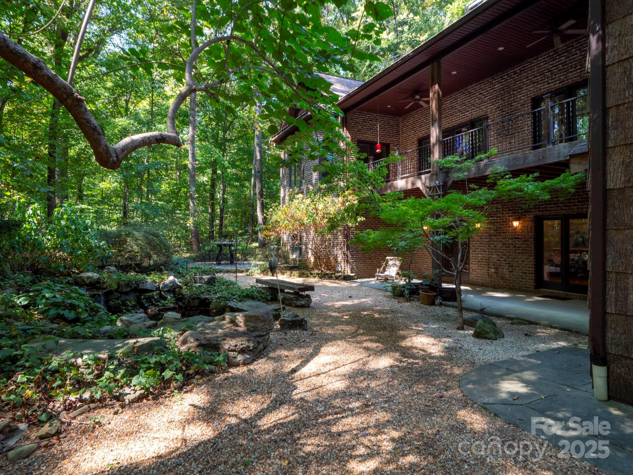 225 Riverton Road Weddington, NC 28104 - Photo 40 of 41 a view of a backyard with plants and a patio