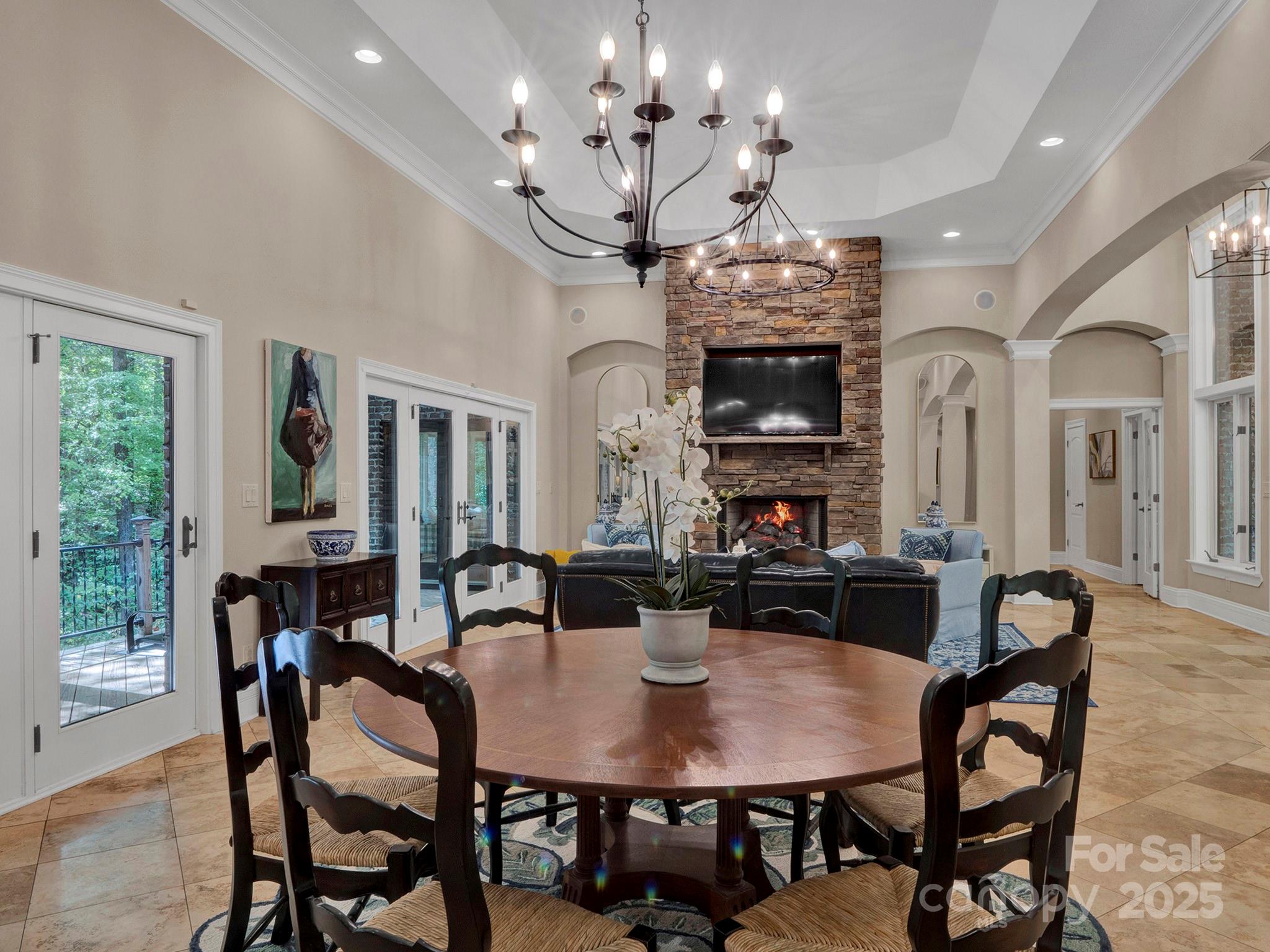 225 Riverton Road Weddington, NC 28104 - Photo 7 of 41 a view of a dining room with furniture a chandelier and wooden floor