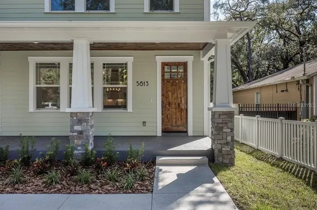 a front view of a house with garage