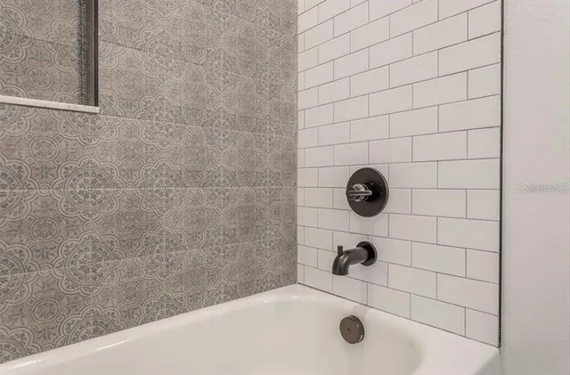 a view of an empty room with windows