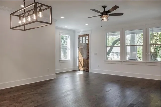 a kitchen with stainless steel appliances granite countertop a sink a stove and cabinets