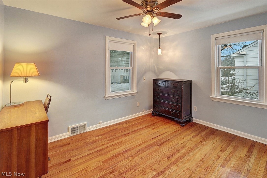 4457 Groveland Road University Heights, OH 44118 - Photo 19 of 24 The third bedroom on the second floor has wood floors, built-in bookshelves, ceiling fan.