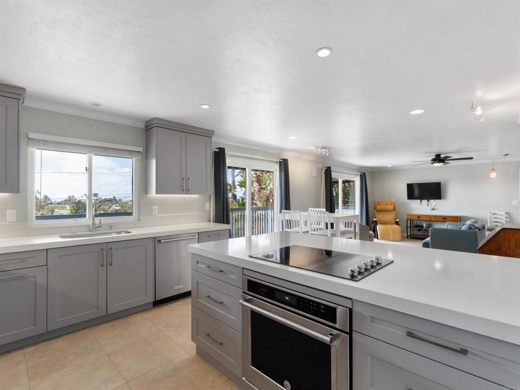 852 Dewitt Avenue Encinitas, CA 92024 - Photo 15 of 41 a kitchen with counter top space sink and stove