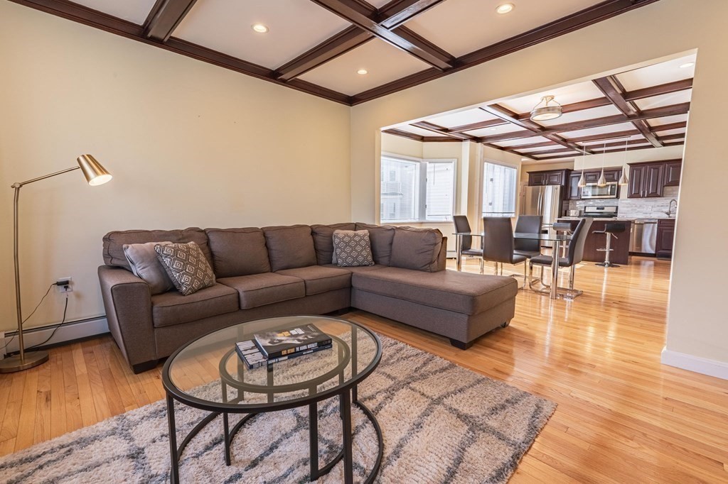 12 Jones Avenue, Unit 1 Chelsea, MA 02150 - Photo 1 of 17 a living room with furniture and wooden floor