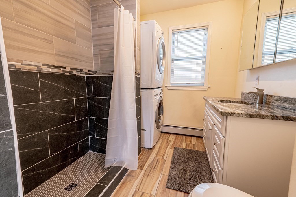 12 Jones Avenue, Unit 1 Chelsea, MA 02150 - Photo 11 of 17 a bathroom with a sink toilet and shower