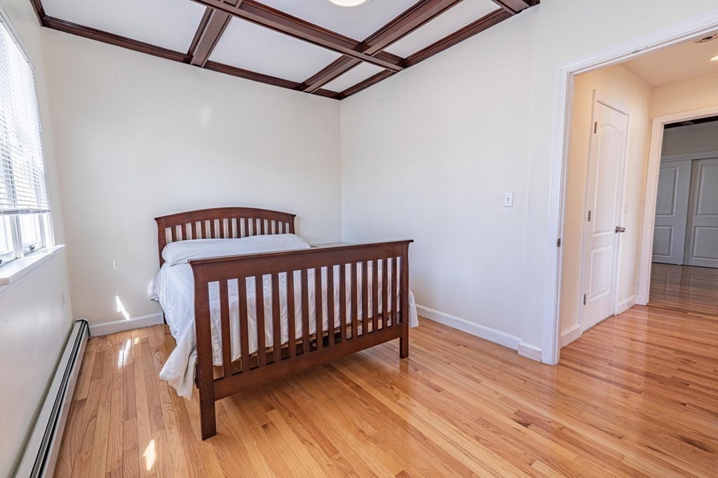 12 Jones Avenue, Unit 1 Chelsea, MA 02150 - Photo 12 of 17 a view of a hallway with wooden floor
