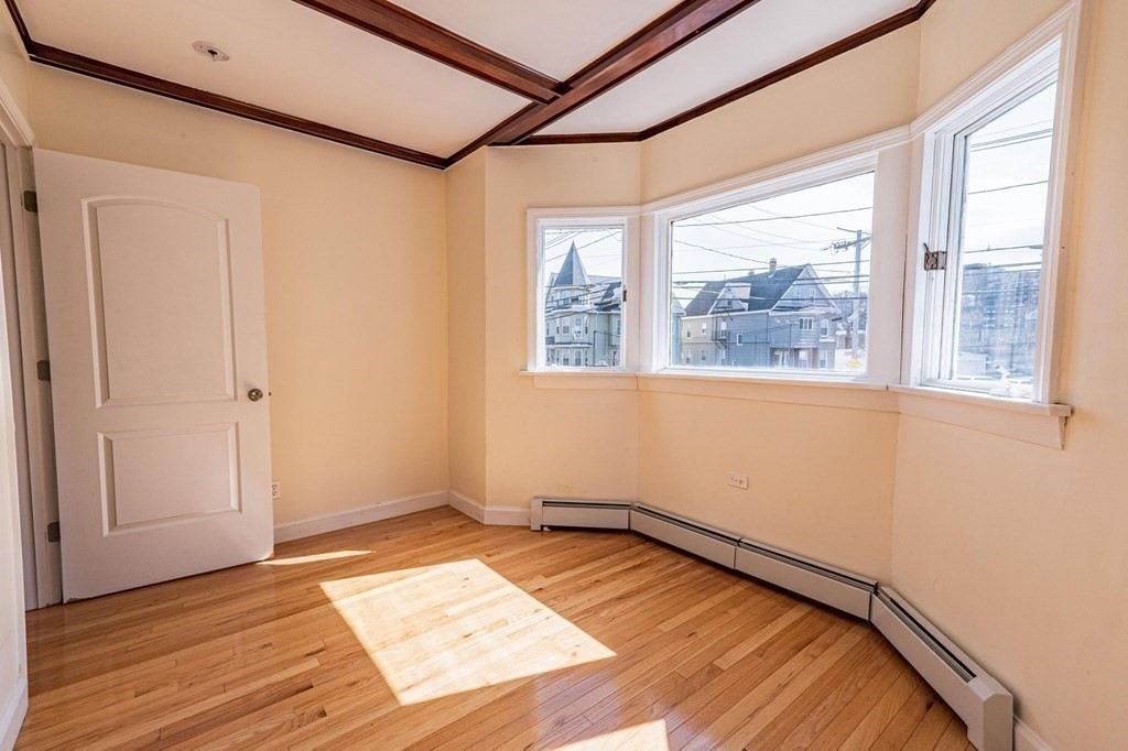 12 Jones Avenue, Unit 1 Chelsea, MA 02150 - Photo 13 of 17 a view of a room with wooden floor and doors