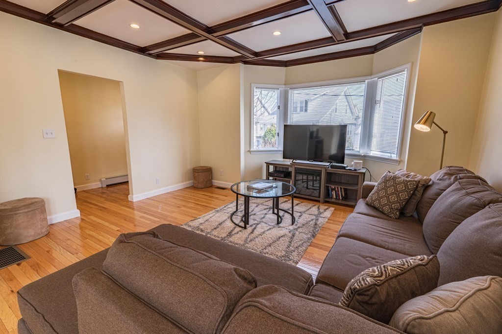 12 Jones Avenue, Unit 1 Chelsea, MA 02150 - Photo 7 of 17 a living room with furniture and a flat screen tv