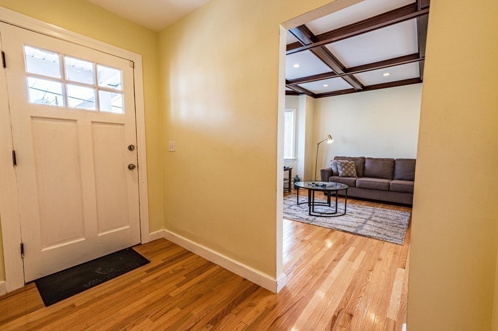 12 Jones Avenue, Unit 1 Chelsea, MA 02150 - Photo 8 of 17 a living room with furniture and a table