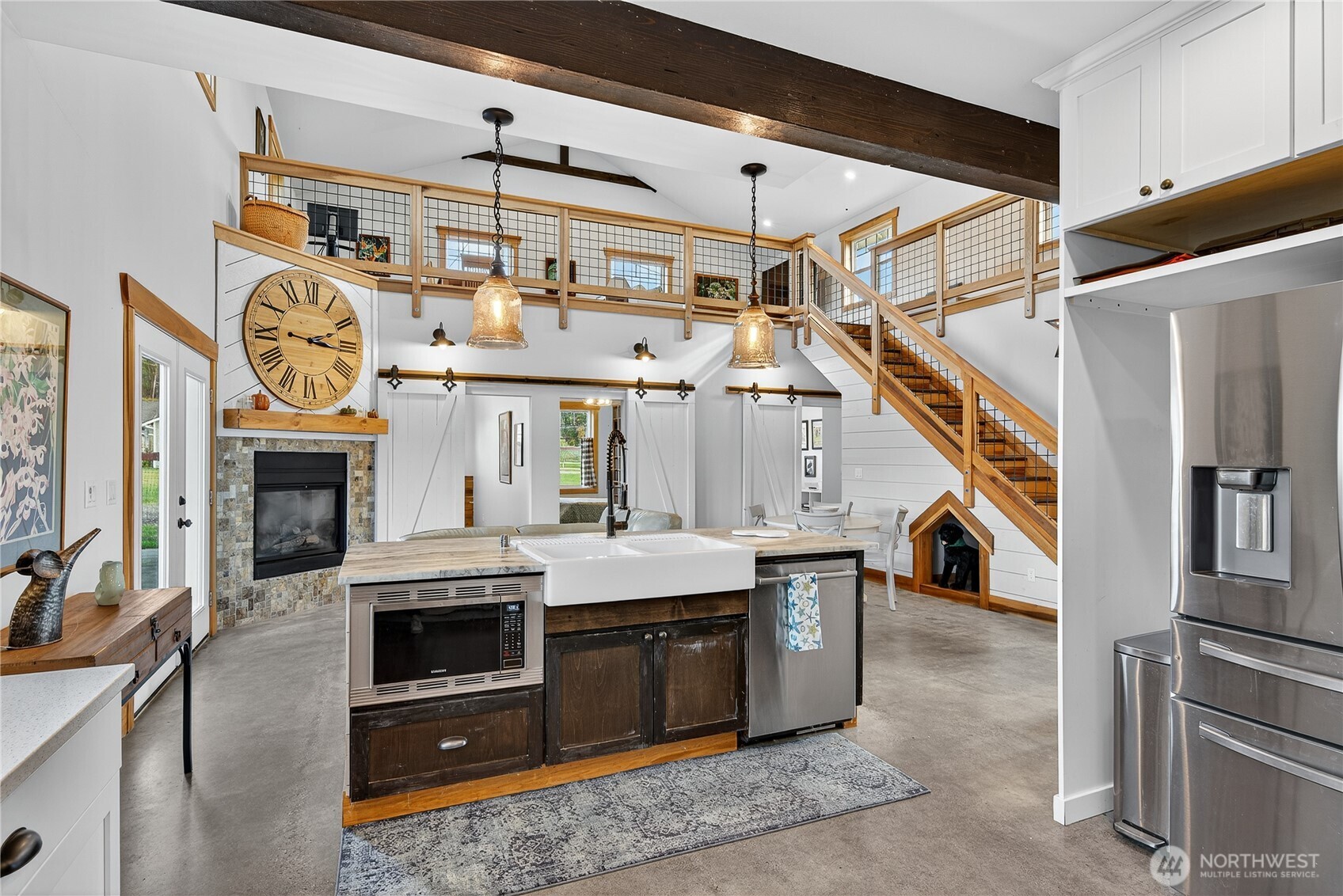 157 Russell Road Camano Island, WA 98282 - Photo 12 of 38 a open kitchen with a stove and a chandelier