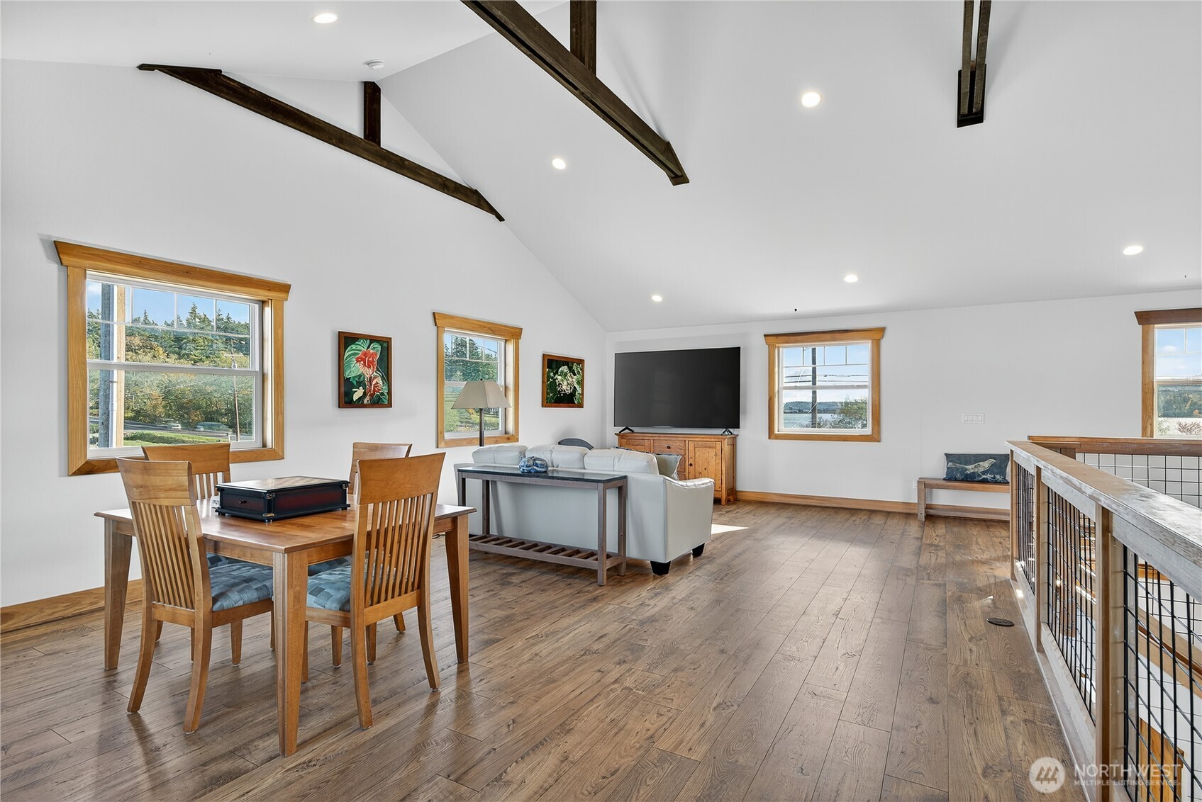 157 Russell Road Camano Island, WA 98282 - Photo 15 of 38 a view of a dining room with furniture and wooden floor