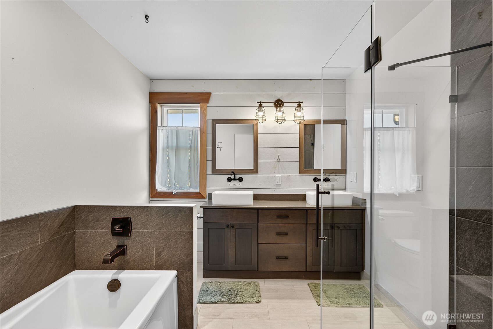 157 Russell Road Camano Island, WA 98282 - Photo 21 of 38 a bathroom with a tub sink and mirror